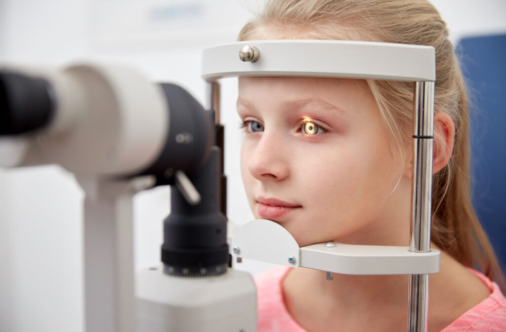 A young girl undergoes a slit-lamp exam.